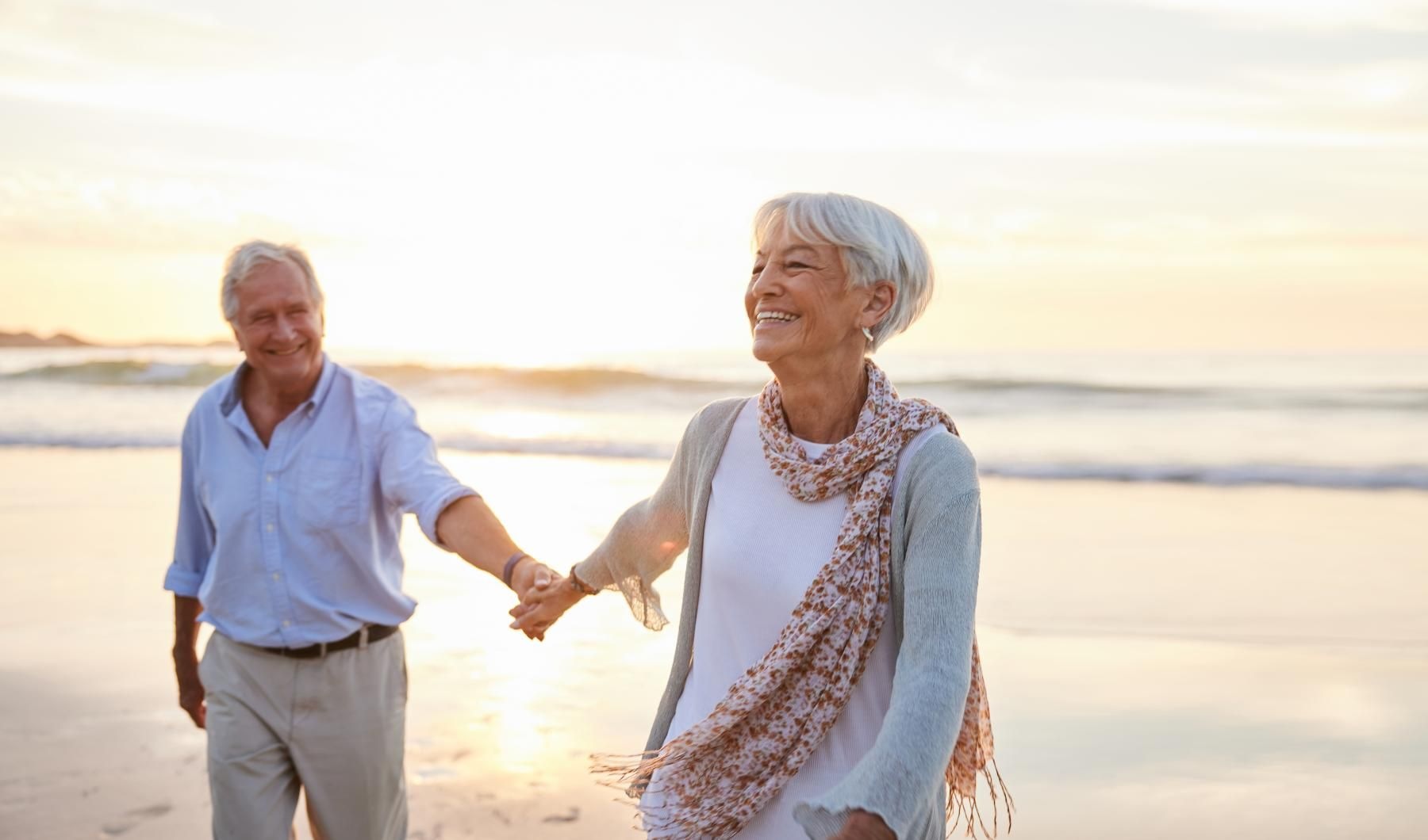 Beach A resident smiling  Overture Hamlin 55 and over apartments in Winter Garden, FL, featuring warm sunlight.