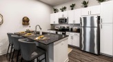 a kitchen with white cabinets