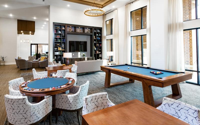 Large game room with pool and poker tables