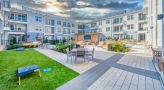 Large courtyard with lawn games and seating