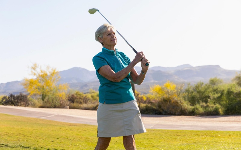 Settle into comfort at Destinations Pueblo an older woman playing golf
