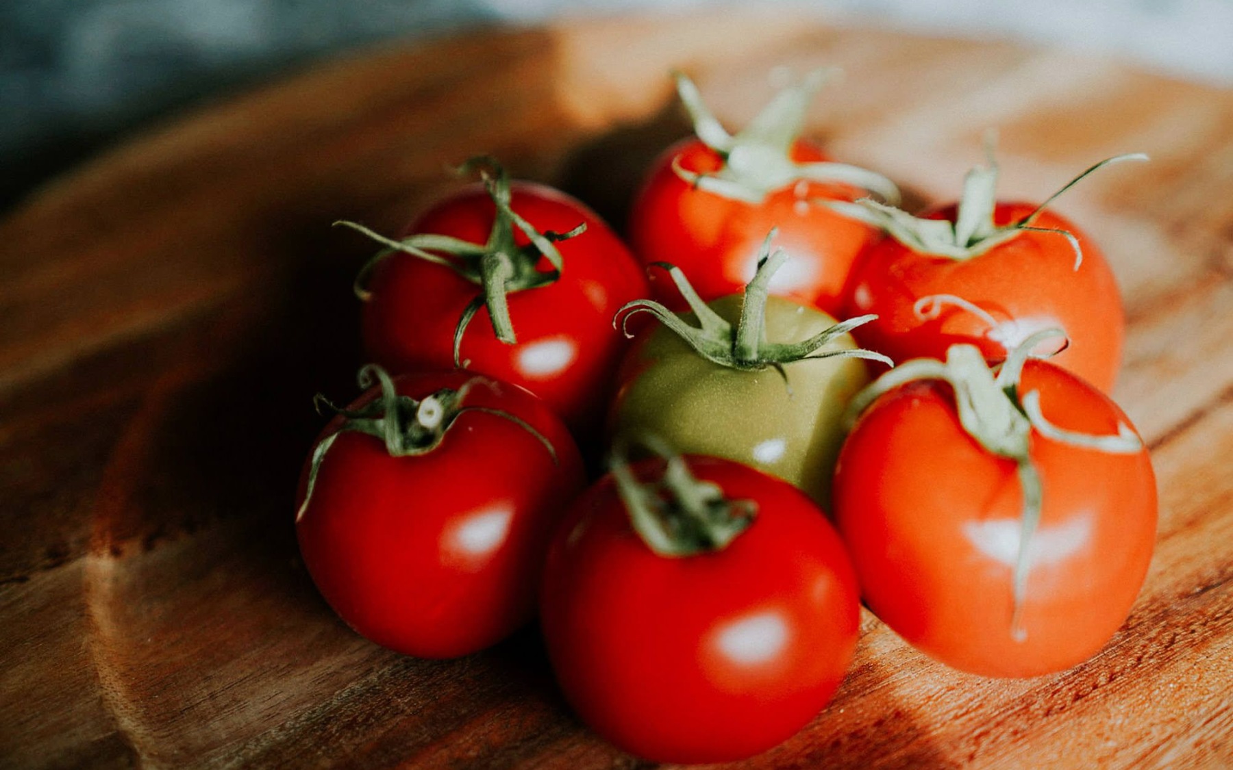 Tomatoes tomatoes sitting on a table