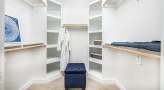 large closet with custom shelving