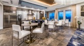 a large resident kitchen with tables and chairs