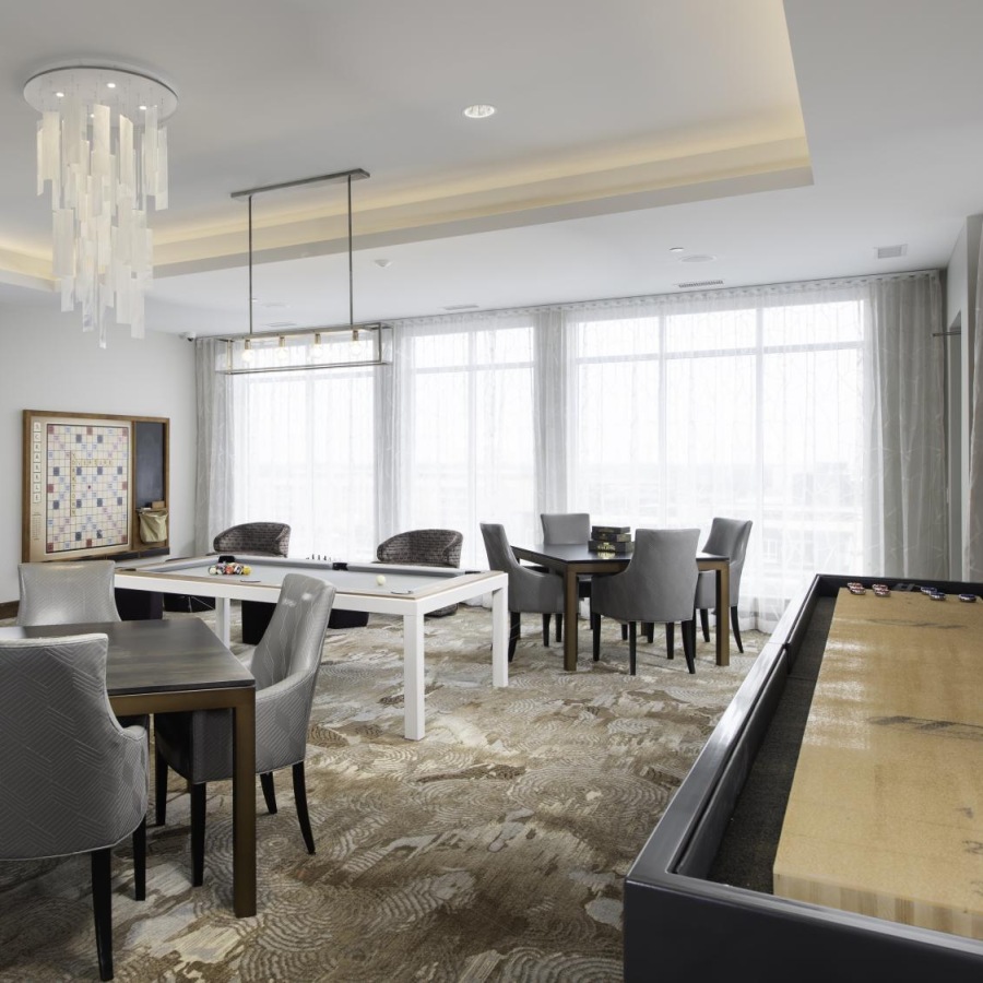 Game Room Residents lounge at Overture Yorktown 55 and older apartments in Lombard, IL, featuring a billiards table.