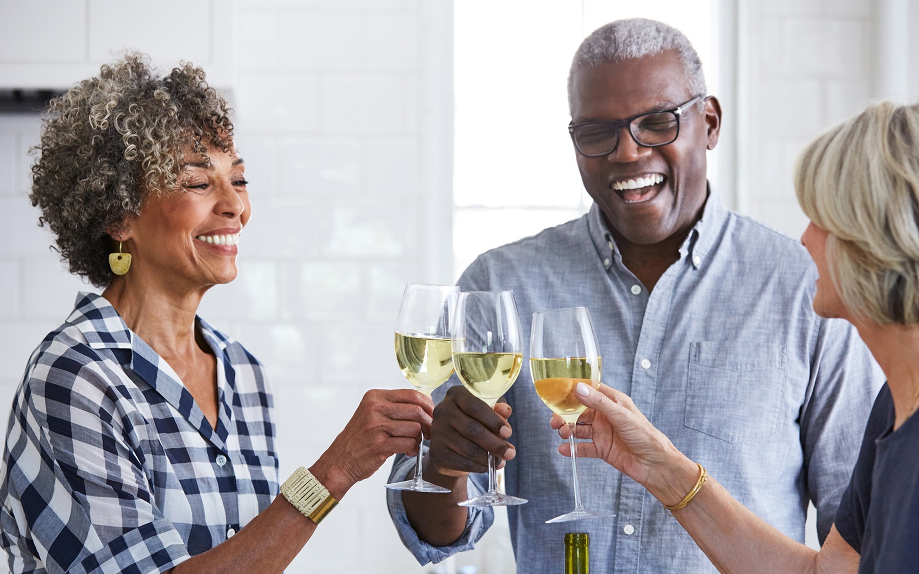 Nearby Activities & Attractions Residents holding up glasses of white wine at Overture Chapel Hill senior living apartments in Chapel Hill, NC.