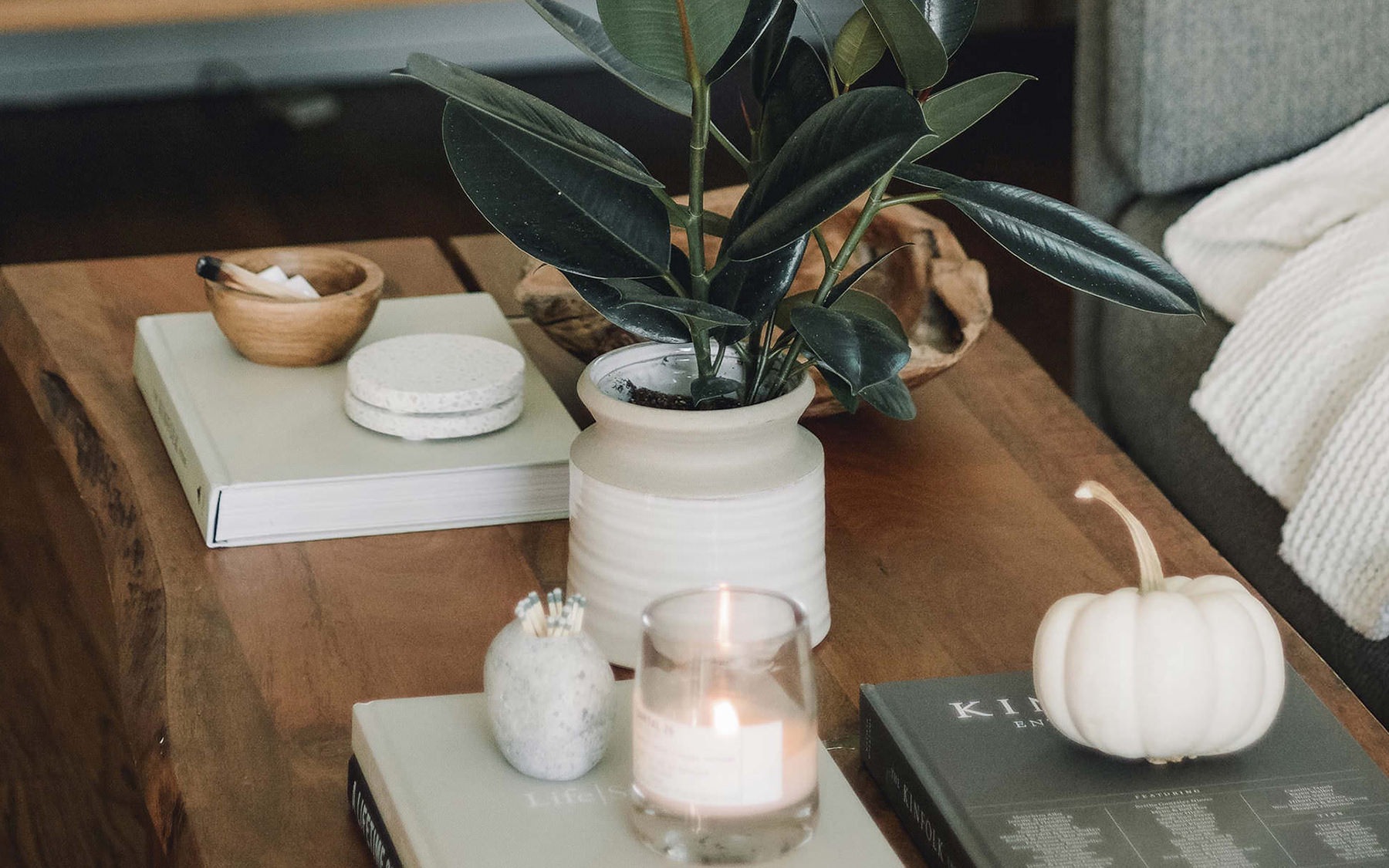 table with candles, plants, and other decor