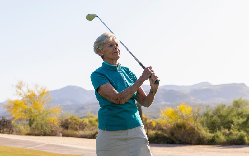 Nearby Activities & Attractions woman outside swinging a golf club