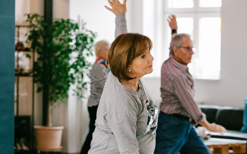 Nearby Activities & Attractions group of people in a room stretching and dancing