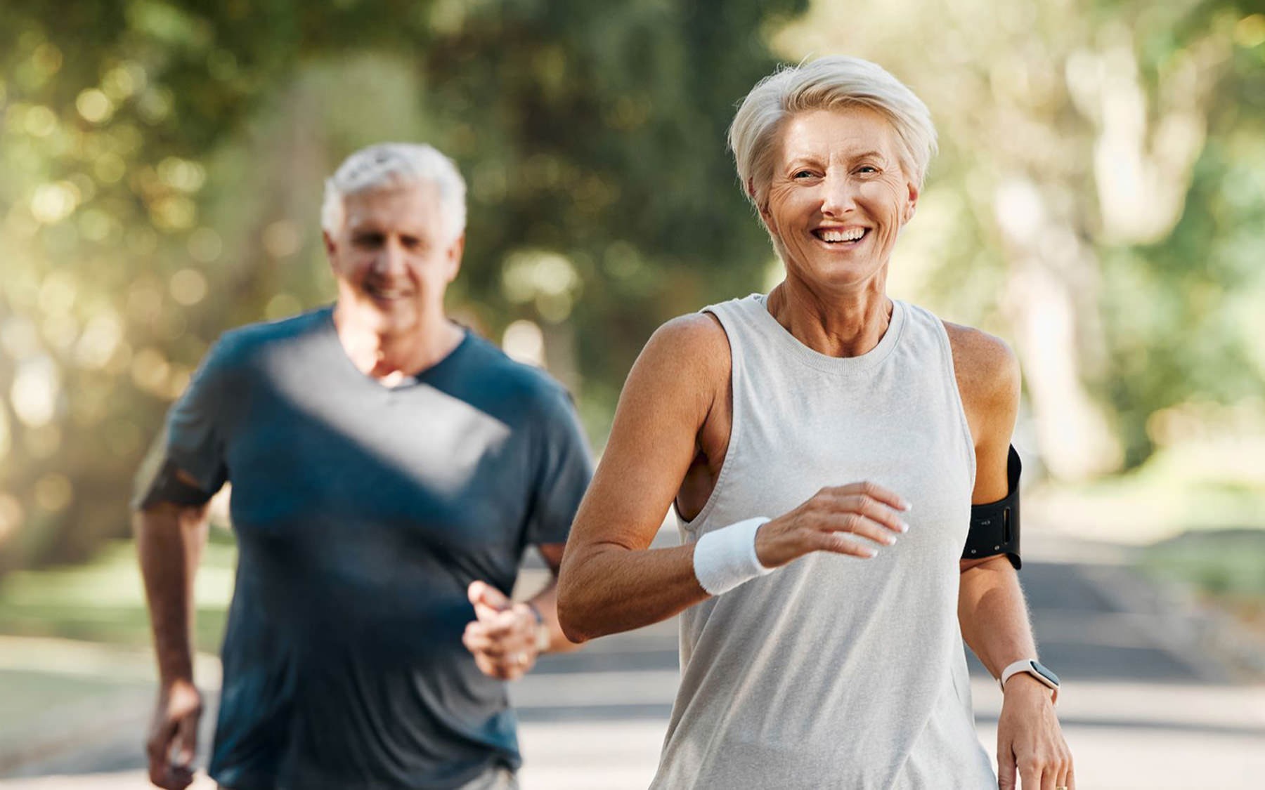 man and woman on a run outside