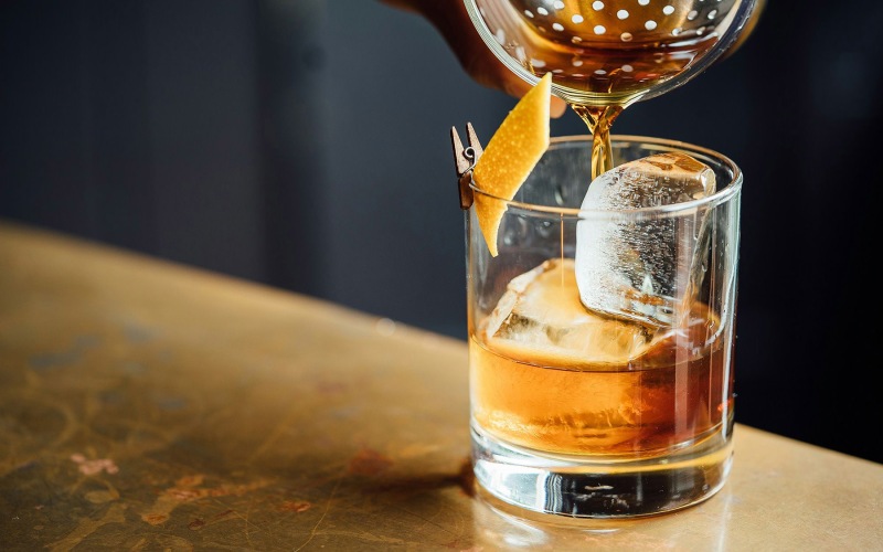 Nearby Activities & Attractions old fashioned drink in a whisky glass with orange peel