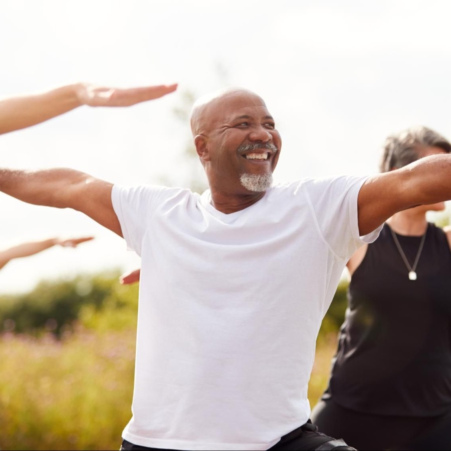 Live your best life people outside doing yoga