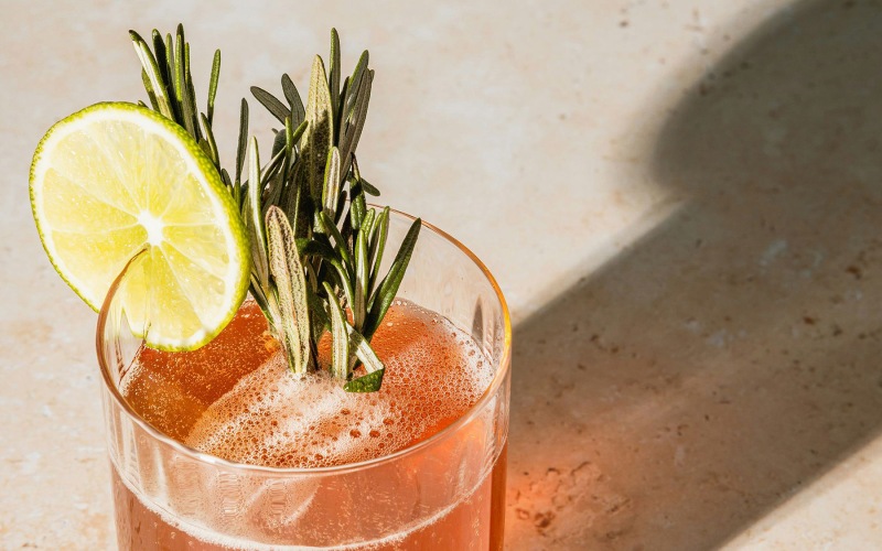 Nearby Activities & Attractions Refreshing drink with lime and rosemary sprigs