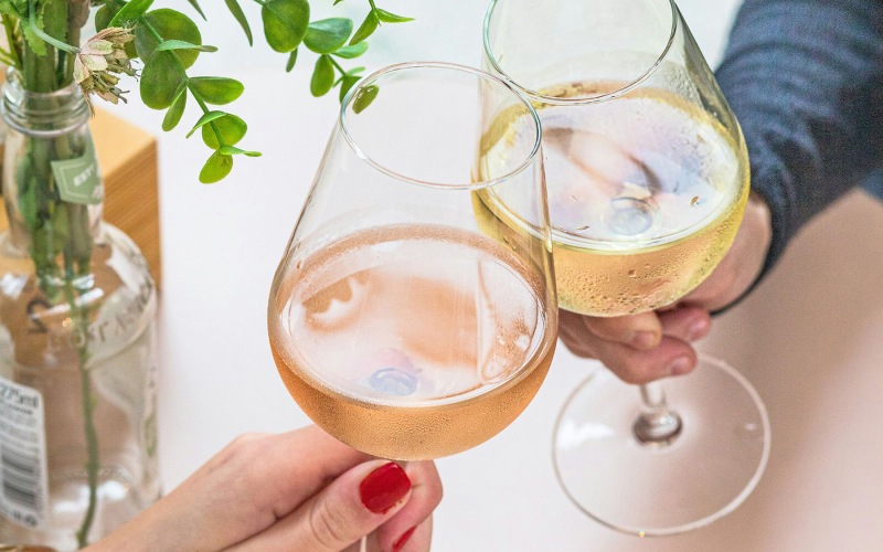 Nearby Activities & Attractions Two hands holding stemmed glasses of white wine