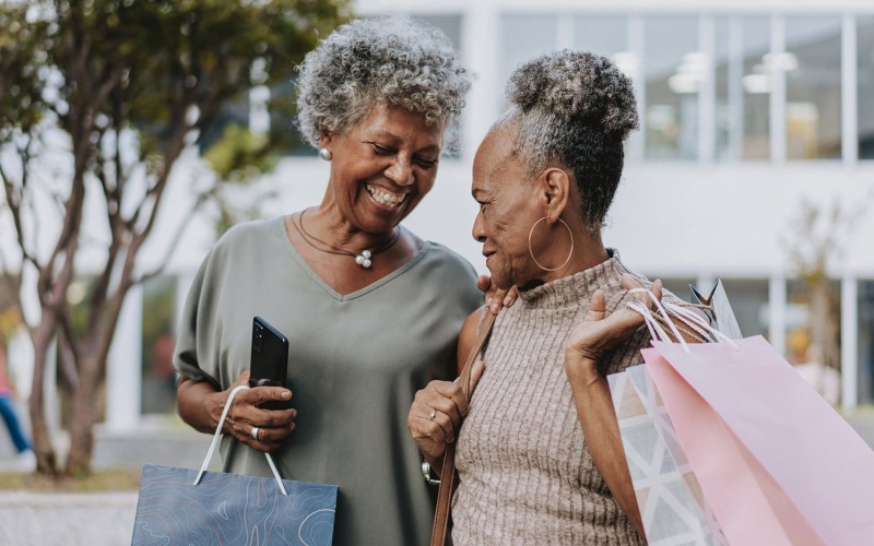 Nearby Activities & Attractions two women walking together with shopping bags outdoors