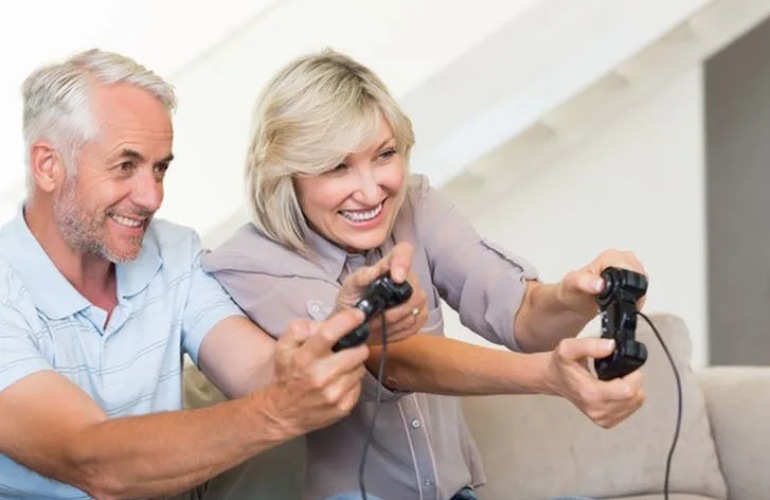 A senior couple playing video games.