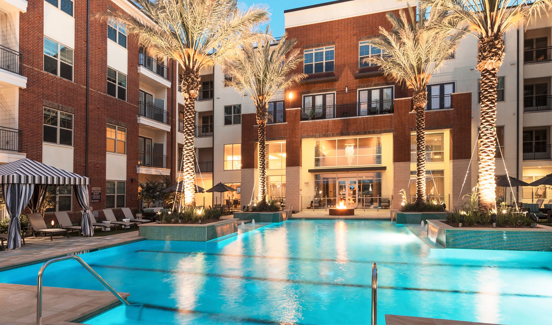 outdoor swimming pool lit at night