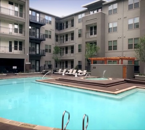 Large sparkling blue swimming pool 