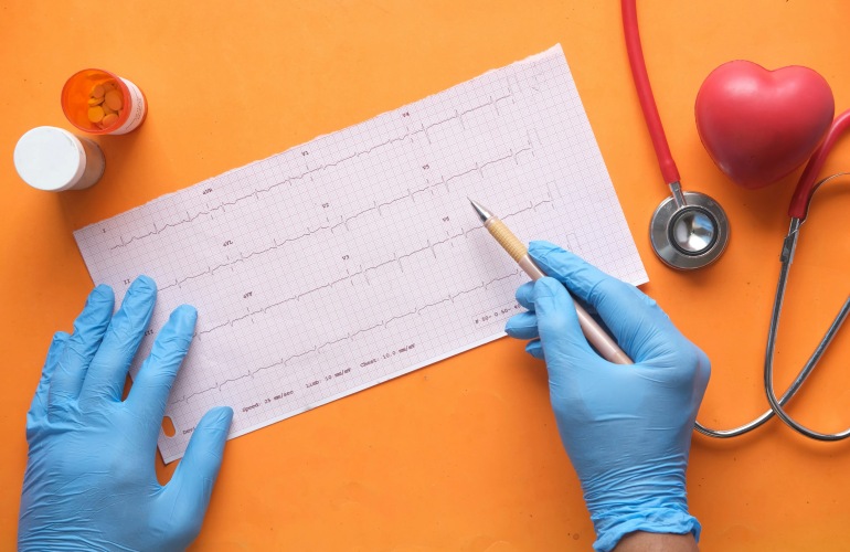 Gloved hands on a medical diagram