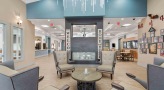 lobby area with chairs and a table