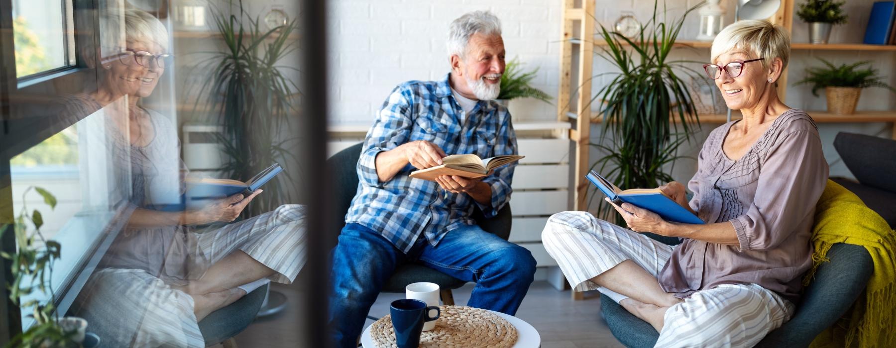 Couple sitting by the window talking 