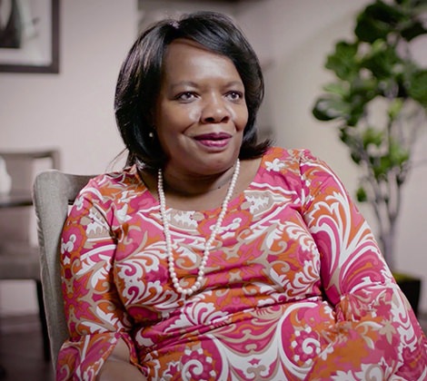 A woman being interviewed sitting in a chair