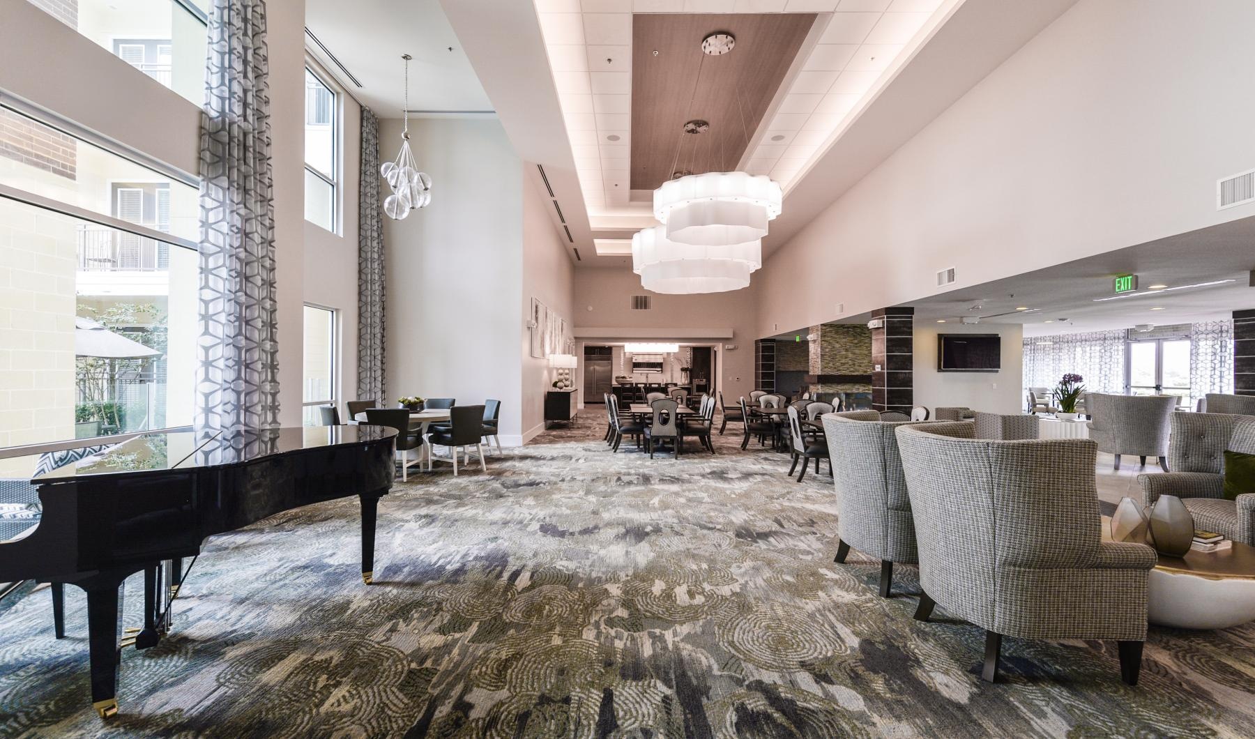 Your Place to Call Home dining hall with a grand piano and stylized lighting