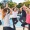 Group of people doing yoga by the pool