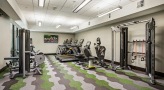 large well lit fitness center with cycling 