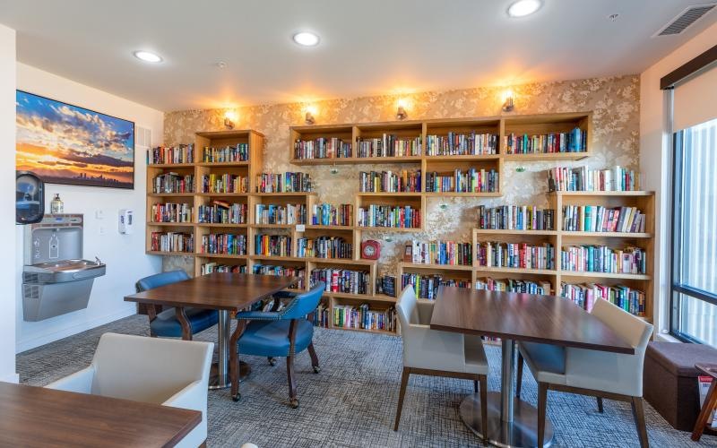 bright library with tables and chairs